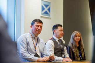 Staff in the boardroom in Low Moss