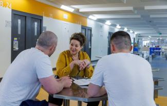 Chaplain speaking with prisoners