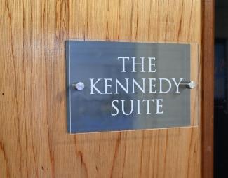 Sign on door saying 'The Kennedy Suite'