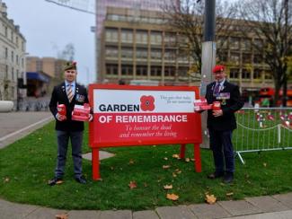 Two staff collecting for Poppy Scotland charity